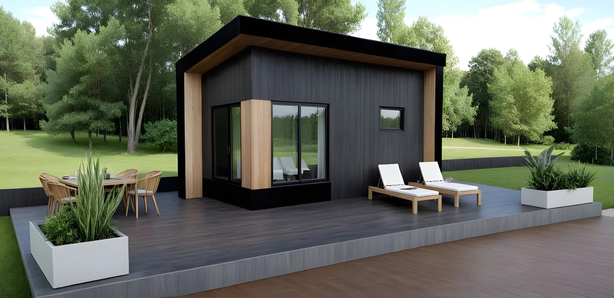A finished modular backyard studio with a dark charred-timber exterior, set on a prepared pad in an Ontario backyard